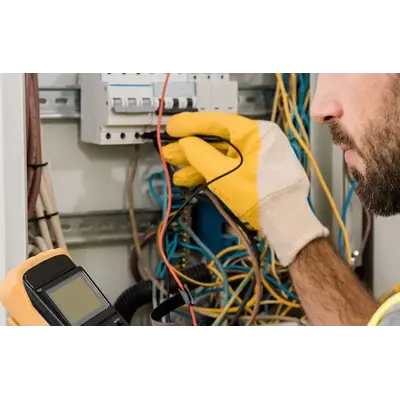 Lawrenceville electrician testing circuit wiring with a multimeter